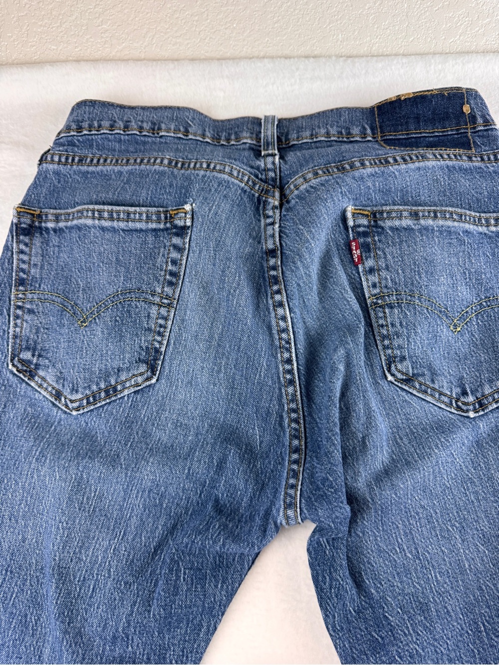 Levi's Blue Denim Jeans with Red Tab Back Pocket‎ Detail